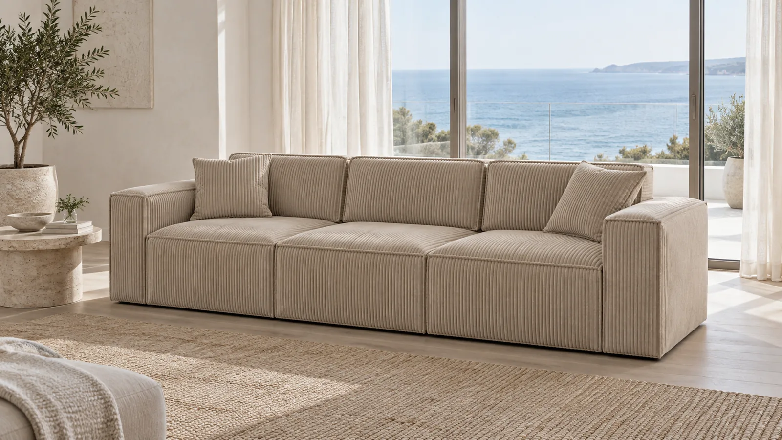 Oat corduroy sofa in a bright coastal apartment