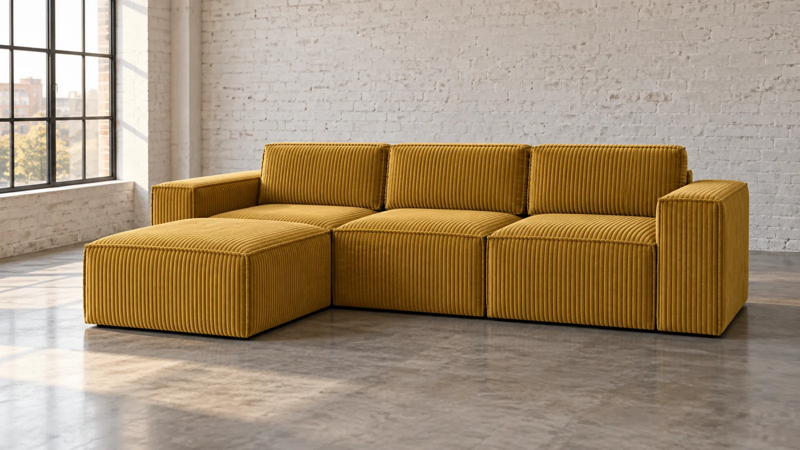 Mustard corduroy sofa with a pouf in a warehouse apartment